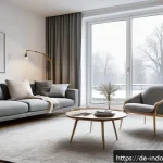 Home 18 미세먼지 필터 사용법 - A modern German apartment living room in winter, showing a sleek HEPA air purifier placed near a clo...